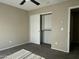 Neutral bedroom with sliding closet doors, carpet flooring and natural light creating a calming and relaxing space at 11570 W Pima St, Avondale, AZ 85323