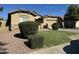 Charming single-story home with desert landscaping, stone accents and a two-car garage on a sunny day at 11570 W Pima St, Avondale, AZ 85323