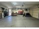 Spacious garage with ample storage, tool chests, and access door at 11570 W Pima St, Avondale, AZ 85323