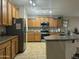 Modern kitchen with stainless steel appliances, sleek countertops, and abundant cabinet space at 11570 W Pima St, Avondale, AZ 85323