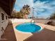 Inviting backyard pool surrounded by a well-maintained patio and mature landscaping at 1257 E Dartmouth St, Mesa, AZ 85203