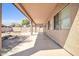 Extended covered backyard patio overlooking low maintenance desert landscaping at 14521 W Gelding Dr, Surprise, AZ 85379
