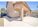 Large covered backyard patio with concrete flooring, ideal for outdoor entertaining at 14521 W Gelding Dr, Surprise, AZ 85379