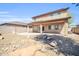 Expansive backyard featuring desert landscaping and a spacious patio area at 14521 W Gelding Dr, Surprise, AZ 85379