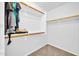 Walk-in closet features built-in shelving and racks for organized storage at 14521 W Gelding Dr, Surprise, AZ 85379