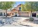 Charming two-story home with attached two car garage and desert landscaping at 14521 W Gelding Dr, Surprise, AZ 85379