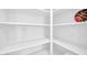 Well organized all white pantry with ample shelving for storage at 14521 W Gelding Dr, Surprise, AZ 85379