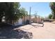 Large backyard with detached storage shed and fenced perimeter at 1524 E 23Rd Ave, Apache Junction, AZ 85119