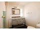 Bright bathroom with modern vanity, framed mirror, and decorative tile backsplash at 1524 E 23Rd Ave, Apache Junction, AZ 85119