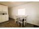 Cozy dining area featuring a white table and seating, with natural light at 1524 E 23Rd Ave, Apache Junction, AZ 85119