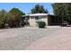 Charming home with a covered carport and well-kept grounds, offering comfort and convenience at 1524 E 23Rd Ave, Apache Junction, AZ 85119