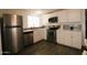 Modern kitchen with stainless steel appliances, white cabinets and sleek countertops at 1524 E 23Rd Ave, Apache Junction, AZ 85119