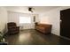 Spacious and well-lit living room featuring modern flooring and comfortable seating arrangements at 1524 E 23Rd Ave, Apache Junction, AZ 85119