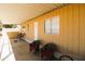 Spacious covered patio with exterior seating and access to home at 1524 E 23Rd Ave, Apache Junction, AZ 85119