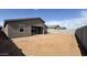 Large backyard with block fence is ready for landscaping and outdoor enjoyment at 15777 W Cheryl Dr, Waddell, AZ 85355