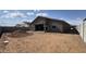 The backyard features a covered patio ready for relaxation, and ample space waiting for customization at 15777 W Cheryl Dr, Waddell, AZ 85355