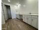 A spacious bathroom with double sinks, a modern design and plenty of cabinet space at 15777 W Cheryl Dr, Waddell, AZ 85355