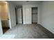 Bedroom with carpet, a closet and a peek of the bathroom with a vanity at 15777 W Cheryl Dr, Waddell, AZ 85355
