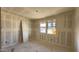 This bedroom features drywall, natural light from the windows and a closet at 15777 W Cheryl Dr, Waddell, AZ 85355