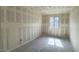 Empty bedroom showcasing the window for natural light and empty space to add furniture at 15777 W Cheryl Dr, Waddell, AZ 85355