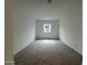 Bedroom with window letting in bright light, neutral walls and carpeted floor at 15777 W Cheryl Dr, Waddell, AZ 85355