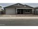 Charming single-story home with a two-car garage and well-maintained landscaping at 15777 W Cheryl Dr, Waddell, AZ 85355