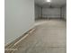 Clean, empty garage, ready for storage or a workshop area at 15777 W Cheryl Dr, Waddell, AZ 85355