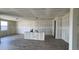 This living room features drywall, natural light from the window and wood-look tile flooring at 15777 W Cheryl Dr, Waddell, AZ 85355