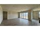 A large open living room featuring hardwood floors and sliding doors to backyard at 15777 W Cheryl Dr, Waddell, AZ 85355