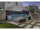 Back yard with custom stone seating area and fire pit perfect for outdoor entertaining at 15837 N 74Th Ln, Peoria, AZ 85382