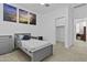 This bedroom features a single bed and a closet in the background at 15837 N 74Th Ln, Peoria, AZ 85382