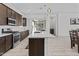 Modern kitchen with center island, stainless steel appliances, and quartz countertops at 15837 N 74Th Ln, Peoria, AZ 85382