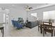 Open-concept living room with lots of natural light and views into the kitchen at 15837 N 74Th Ln, Peoria, AZ 85382