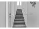 This carpeted stairway leads to an upper level with bright lighting at 15837 N 74Th Ln, Peoria, AZ 85382