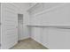 This large closet includes shelving and a door at 15837 N 74Th Ln, Peoria, AZ 85382