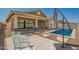 Inviting backyard features a refreshing pool, patio, and covered seating area, perfect for outdoor enjoyment at 16064 W Montana De Oro Dr, Surprise, AZ 85387