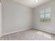 Serene bedroom with carpet, ceiling fan, and window providing natural light at 16064 W Montana De Oro Dr, Surprise, AZ 85387