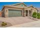 Beautiful home featuring a two-car garage, desert landscaping, and a paved driveway at 16064 W Montana De Oro Dr, Surprise, AZ 85387