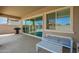 Covered patio with outdoor furniture, sliding glass doors, and space for entertaining at 16064 W Montana De Oro Dr, Surprise, AZ 85387