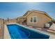 Backyard pool with patio and exterior view of single Gathering home at 16064 W Montana De Oro Dr, Surprise, AZ 85387