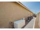 Side yard with privacy fence, gravel landscape, and utility access at 16064 W Montana De Oro Dr, Surprise, AZ 85387