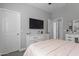 Bedroom with a TV over a white dresser and carpet flooring at 16438 W Buchanan St, Goodyear, AZ 85338