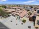 Charming single-story home featuring a tile roof, neutral stucco, a two-car garage, and low-maintenance desert landscaping at 16438 W Buchanan St, Goodyear, AZ 85338