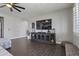 Comfortable living room with modern furnishings, including a TV, console and stylish decor at 16438 W Buchanan St, Goodyear, AZ 85338