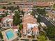 Overhead shot highlights a neighborhood with houses, a community pool, and parking spots at 1717 E Union Hills Dr # 1110, Phoenix, AZ 85024