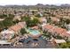 Extensive view of a neighborhood, revealing community pool, landscaping, and parking spots at 1717 E Union Hills Dr # 1110, Phoenix, AZ 85024