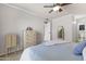 Comfortable bedroom featuring a dresser and views into the ensuite bathroom at 1717 E Union Hills Dr # 1110, Phoenix, AZ 85024