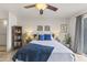 Inviting bedroom with a ceiling fan, warm lighting, and stylish decor at 1717 E Union Hills Dr # 1110, Phoenix, AZ 85024
