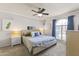 Cozy bedroom featuring a ceiling fan, complementary decor, and natural light at 1717 E Union Hills Dr # 1110, Phoenix, AZ 85024