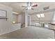 Spacious bonus room features a ceiling fan, skylights, and adjacent loft area at 1717 E Union Hills Dr # 1110, Phoenix, AZ 85024